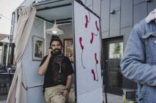 An arts project, led by Drew Arrieta and Maddy Bartsch, aims to bridge the communication gap between rural and urban Minnesotans through honest, anonymous conversations. The chats take place in makeshift phone booths. (Springboard for the Arts)