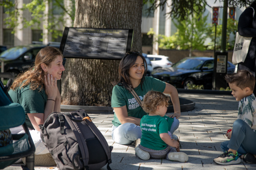 Oregon Food Bank President Andrea Williams sits with dozens of kids, parents and advocates before entering the Oregon State Capitol. (Oregon Food Bank)