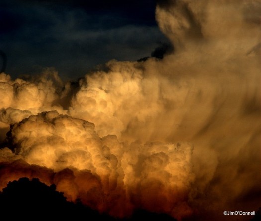 Thunderheads east of Taos, NM. Light filtered through fire smoke. by Jim http://www.aroundtheworldineightyyears.com/summer-solstice/O'Donnell 