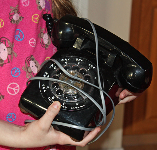 PHOTO: old telephone wrapped in cord. Photo credit: Deborah Smith