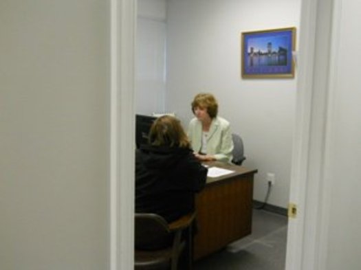PHOTO: Maryland Legal Aid paralegal meeting with a Pro Bono Day visitor