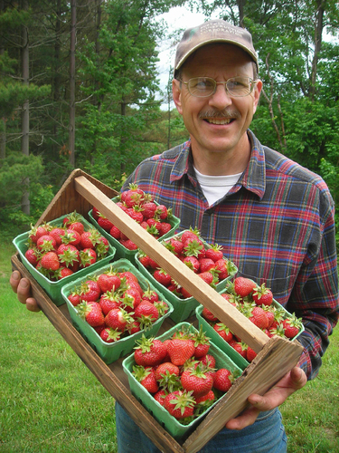 PHOTO: Ron Meyer holding strawberries. Photo credit: Mary Meyer.