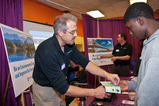 PHOTO: CH2M Hill is one company on the Equality Forum list, for its efforts to foster a diverse and inclusive engineering workforce. Here, employees represent the firm at a high school and college career fair (in Milwaukee, Wisc.) Courtesy of CH2M Hill.