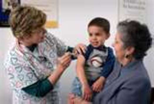PHOTO: Child receiving a shot. Courtesy CDC.