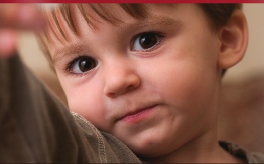 PHOTO: picture of child on front of Autism Recommendation report.