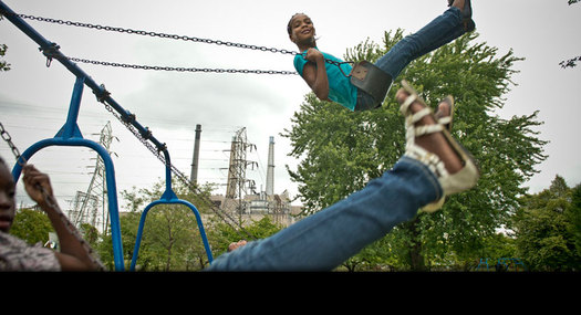 PHOTO: A Child in Belinger Park, located between the River Rouge plant and steel mill. Credit: Ami Vitale/Panos Pictures