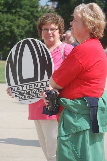 PHOTO: Mary Pollock at a State Capitol protest last summer. Courtesy of Michigan NOW.