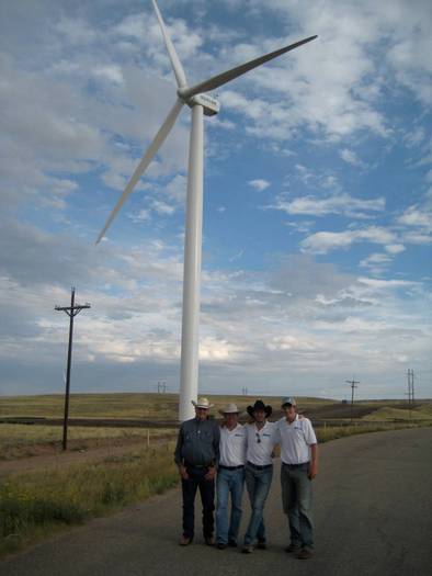 PHOTO: Nate Sandvig (2nd from left) and his project team at a windfarm site. Courtesy of Sandvig.