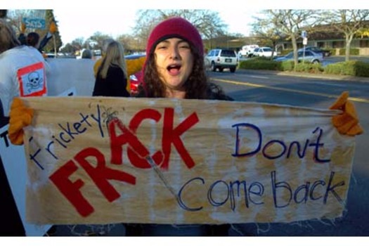 Scarlett Russell, an activist with the Center for Biological Diversity, is protesting in Sacramento against the Bureau of Land Management's sale of California public lands for oil drilling and fracking. Photo Credit: Patrick Sullivan.