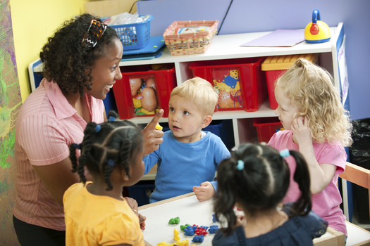 PHOTO: Preschool classroom, with one teacher for four students. Courtesy: Qualistar Colorado.