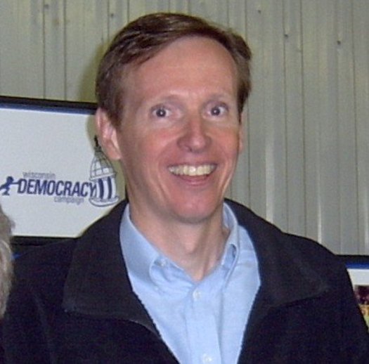 PHOTO: Mike McCabe of the Wisconsin Democracy Campaign may be smiling  but not about the political contributions that have helped push SB1 through the State Assembly. Courtesy of Wisconsin Democracy Campaign.
