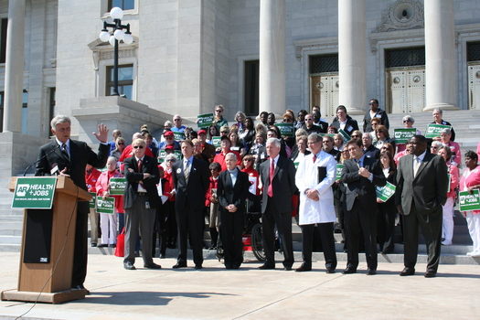 PHOTO: Gov. Mike Beebe shares his plan to cover more uninsured Arkansans with Thursday's crowd on the State Capitol steps. Photo by Anna Strong.  