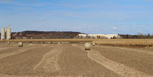 PHOTO: A giant mound of mined sand amidst Wisconsin farm fields. CREDIT: Carol Mitchell