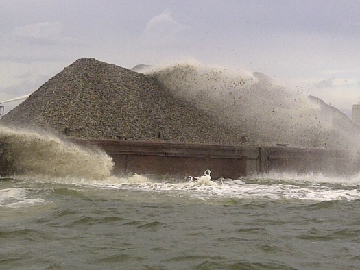 PHOTO: Barges are carrying mined oyster shells to public oyster grounds in the James River, as well as in Mobjack Bay, the York River and off Tangier Island. Photo credit: Natural Resources Secretary Doug Domenech
