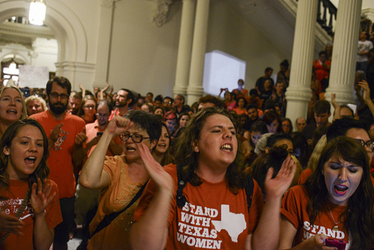 PHOTO: Opponents rallied at the State Capitol as abortion restrictions were turned back, only to be brought back to the forefront when Gov. Perry immediately called a second special session. Photo credit: Lauren Gerson.