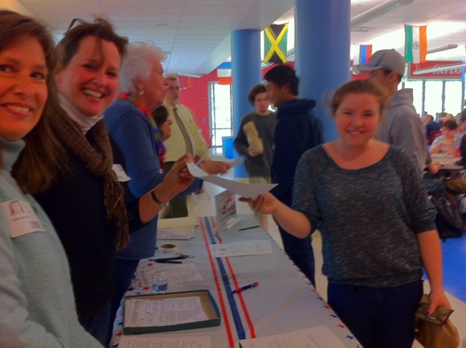 Photo of voter registration drive at Wilton High School. The League of Women voters is using the 93rd birthday of the 19th Amendment to highlight voter outreach. Photo Credit: Young-Kleinfeld