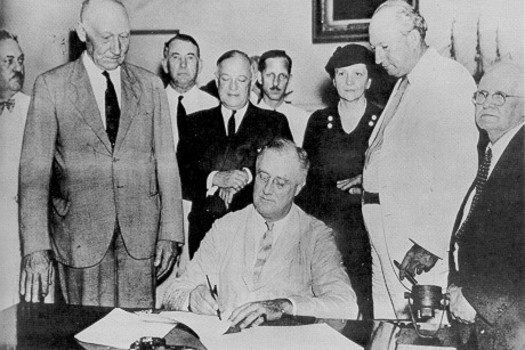 President Franklin D. Roosevelt, signing the original Social Security Act on August 14, 1935, calls it, 