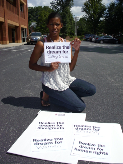 Photo: Etheridge preparing for silent vigil at Guildford College. Courtesy: American Friends Service Committee
