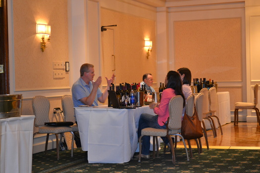 PHOTO: The Washington Dept. of Agriculture arranges trade meetings for local food and wine producers  with buyers from other countries. Here, Claar Cellars' Tom Mackenzie meets with buyers from Mexico. Courtesy Washington Dept. of Agriculture.