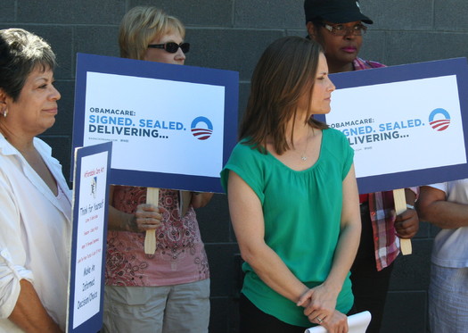 PHOTO: Phoenix mom Stacey Lihn (in green) waits to speak at Organizing for Action Arizona kick-off event in support of Obamacare. CREDIT: Doug Ramsey.