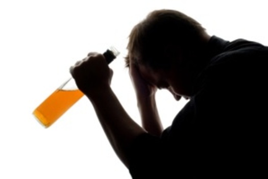 PHOTO: Medicaid expansion would extend addiction treatment services to more Ohioans. Photo: man with an alcohol bottle. Courtesy:womenshealth.gov.