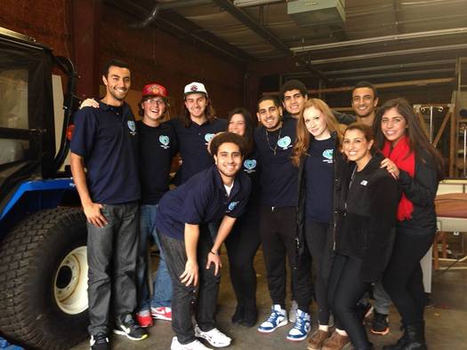 PHOTO: Members of the Medical Outreach Group load up a trailer with the supplies and equipment they've collected that will be distributed to clinics that serve low-income patients. Photo courtesy of Andrew Michail.