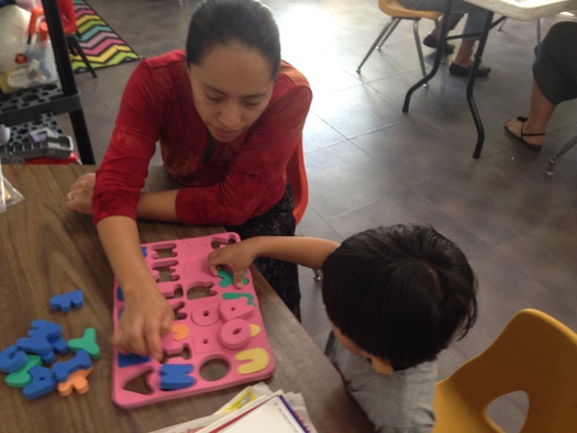 PHOTO: The YMCA Early Learning Readiness Program for Informal Family, Friend, and Neighbor Caregivers teaches those who watch young children how to provide better learning opportunities for those in their care. Photo courtesy YMCA of the USA. 