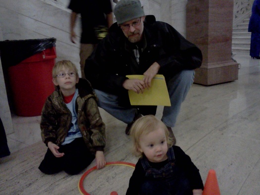 PHOTO: Cody Nicholas of Clay County brought his sons Jamie and Brian to the State Capitol for Kids and Families Day Tuesday, the same day as one of the bills backed by the day's organizers cleared a tough committee. PHOTO by Dan Heyman  