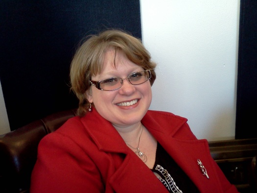 Jamie Gudiel of Morgantown says a higher minimum wage - now being considered by the Legislature - might enable her quit one of her two jobs and spend more time with her young children. PHOTO by Dan Heyman 