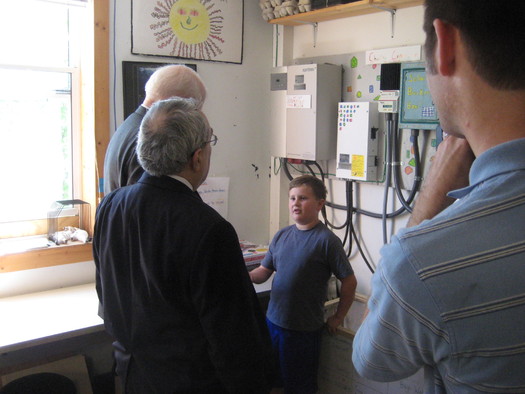 PHOTO: Fourth-grade students explain the solar installation that powers their classroom to Congressmen G.K. Butterfield and David Price. Photo courtesy Environment North Carolina