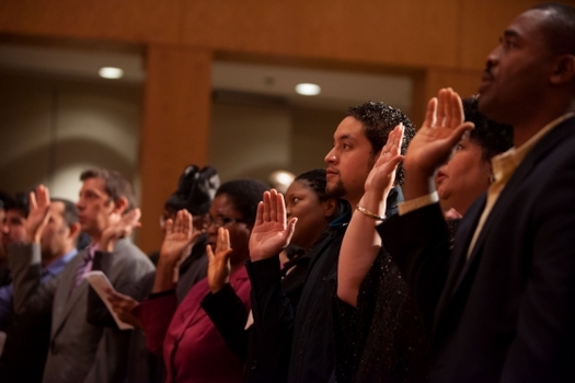 PHOTO: New U.S. Citizens take the oath of allegiance during a naturalization ceremony. Photo courtesy of The White House
