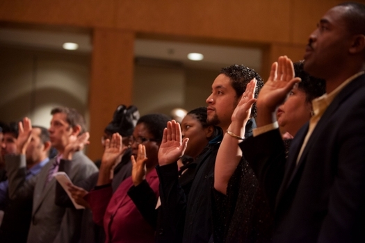 PHOTO: New U.S. citizens take the oath of allegiance during a naturalization ceremony. Photo courtesy of the White House