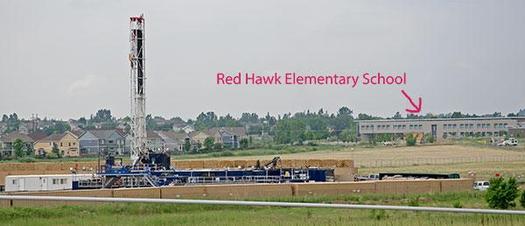 PHOTO: This photo, seen in the petition filed by Earthjustice on Tuesday, shows an Erie, Colo., school located within two miles of 66 oil and gas well sites. Photo courtesy Lighthouse Solar.