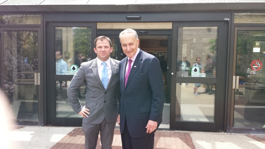 Photo: Jeffrey Guillot with U.S. Sen. Chuck Schumer (D-NY), who is supporting legislation that would allow young professionals to reduce interest rates on college debt. Credit: Suburban Millennial Institute