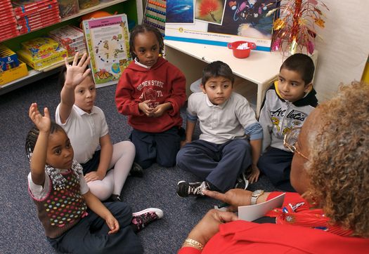 PHOTO: Experience Corps volunteers in Baltimore work with students one-on-one and in small groups, targeting kids who are struggling with literacy. Photo credit: Experience Corps Baltimore.