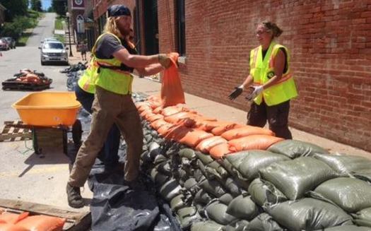 PHOTO: AmeriCorps volunteers helped construct a sandbag wall to protect Clarksville's historic downtown, but they say more needs to be done to find a long-term solution to flooding in this Mississippi River community. Photo credit: Clare Holdinghaus.