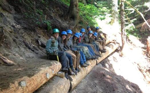 PHOTO: There isn't much time for sitting as a member of this youthful crew working to relocate the Kelly Creek Trail in the Mount Baker-Snoqualmie National Forest. It's one of 50 projects across the country to commemorate the 50th anniversary of the Wilderness Act. Photo courtesy of Northwest Youth Corps.