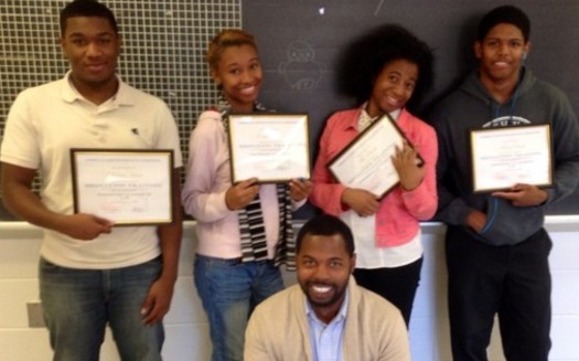 PHOTO: AFSC Peace Education Director Joshua Saleem, front, with four students honored for their Peer Mediation Program work at Northwest Academy of Law in St. Louis. Photo courtesy of American Friends Service Committee.