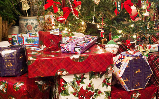 PHOTO: While it's hard not to let the children tear into the wrapping paper, experts say saving it for another use, or recycling it where possible, is just one way to reduce the impact of the holiday on the environment. Photo credit: earl53/morguefile.com. 