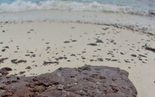 PHOTO: Oil began washing ashore on Okaloosa Island in Fort Walton Beach following the BP spill in 2010. Photo credit: Drew Buchanan/Wikimedia Commons.
