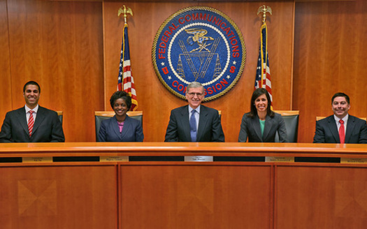 PHOTO: Tom Wheeler (center), chairman of the Federal Communications Commission, is seeking to regulate the Internet as a utility. Photo courtesy Federal Communications Commission.