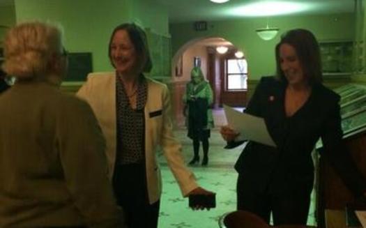 PHOTO: Glenna DeJong and Marsha Caspar, shown here with Ingham County Clerk Barbara Byrum on their wedding day, were the first same-sex couple in Michigan history to legally wed. They will celebrate their first anniversary this weekend by continuing to fight for marriage equality in the state. Photo courtesy of B. Byrum.