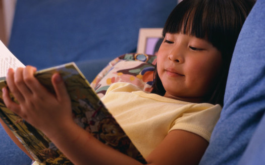PHOTO: Reading during summer vacation is critical for students to maintain their academic skills and avoid what educators call summer brain drain. Photo credit U.S. Department of Health and Human Services.