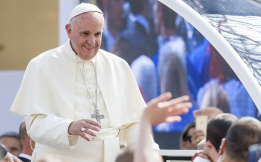 Pope Francis greets a crowd during a recent visit in Turin, Italy. Credit: Nico_Campo/iStockPhoto