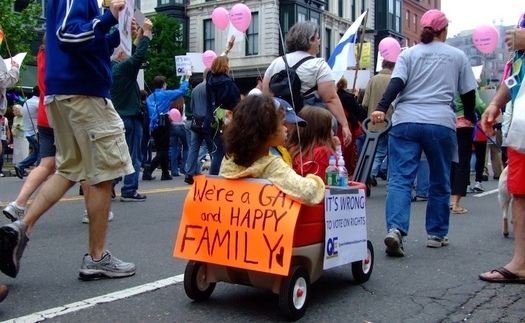 A family is part of a recent Gay Pride parade. A Utah legislator wants to give heterosexual families preference over gays in adopting children in the state. (Wikimedia Commons)