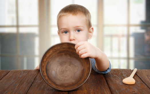 Advocacy groups are pushing political candidates to focus on child poverty. (Milkos/iStockphoto)