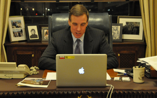 Sen. Mark Warner, D-Va., co-founder of the cyber-crime caucus and seen here using Skype, says the DNC hack could have profoundly disturbing implications. (Warner's Office)