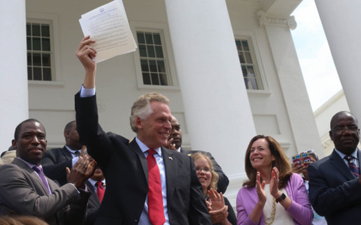 As Gov. Terry McAuliffe signs orders restoring voting rights to reformed Virginia felons, many are questioning the law making that necessary. (Michaele White/Governor's Office/Flickr)