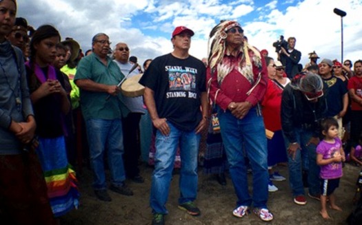 Chairman Archambault (left) and Chief Arvol Looking Horse are involved in the latest fight against the Dakota Access Pipeline that also spotlights decades of racial discrimination against Native populations in North Dakota. (Photo by Jenni Monet)