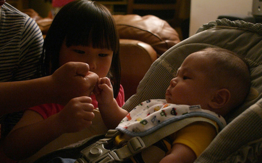 Sometimes a fist bump can suffice for children to show affection toward family members, says Taryn Yates of the Idaho Children's Trust Fund. (mliu92/Flickr)